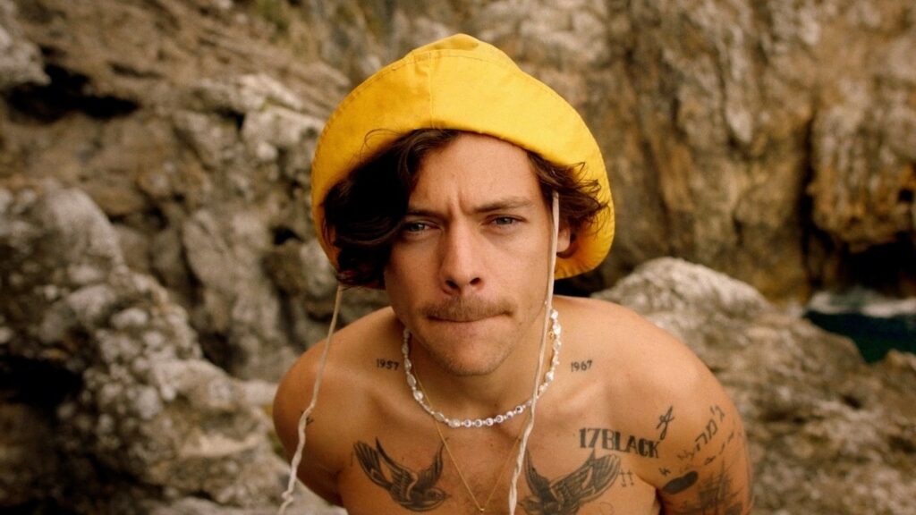 Harry Styles Shows Off More Iconic Outfits in “Golden” Music Video