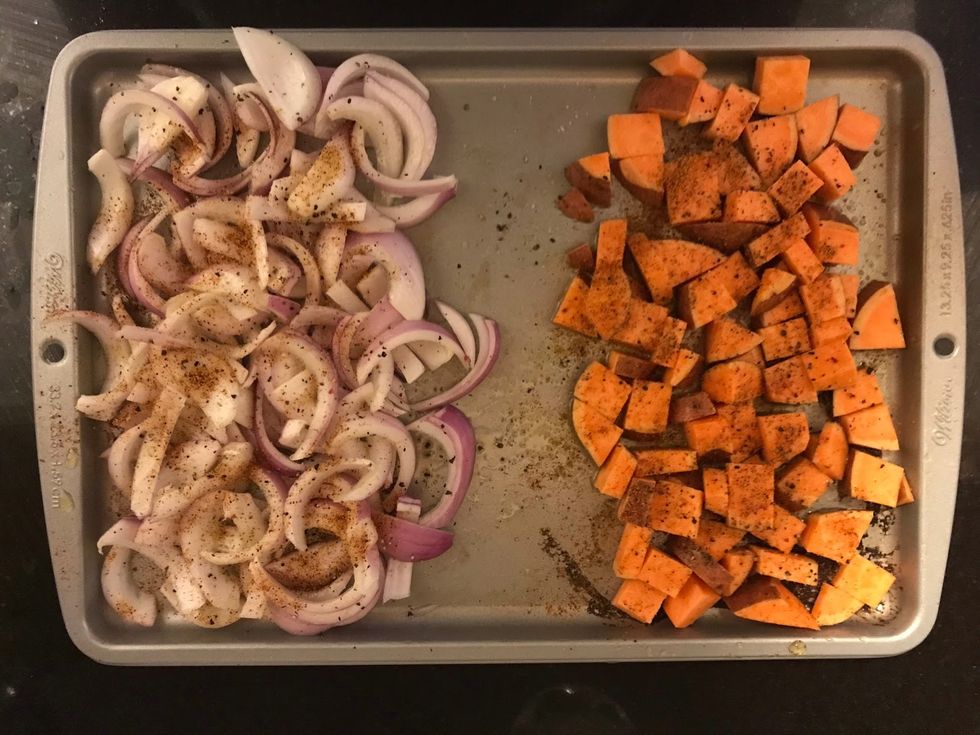 spiced sweet potatoes and onions on a tray