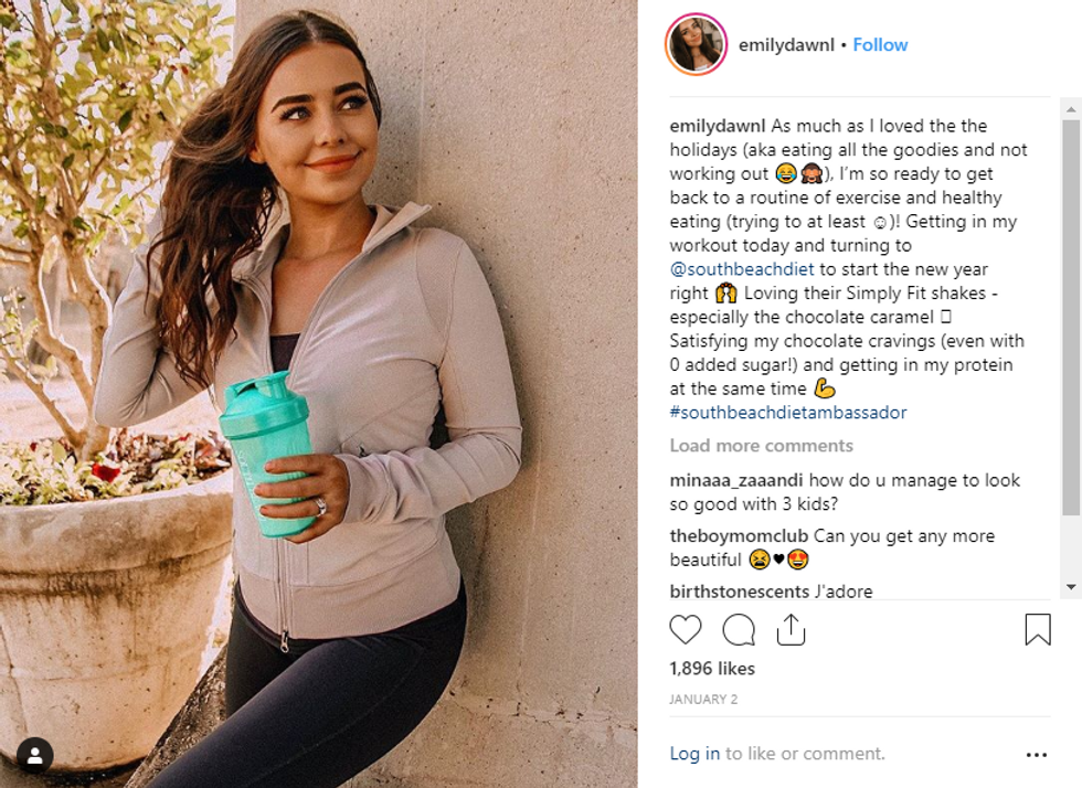 brown haired woman with blue south beach cup 
