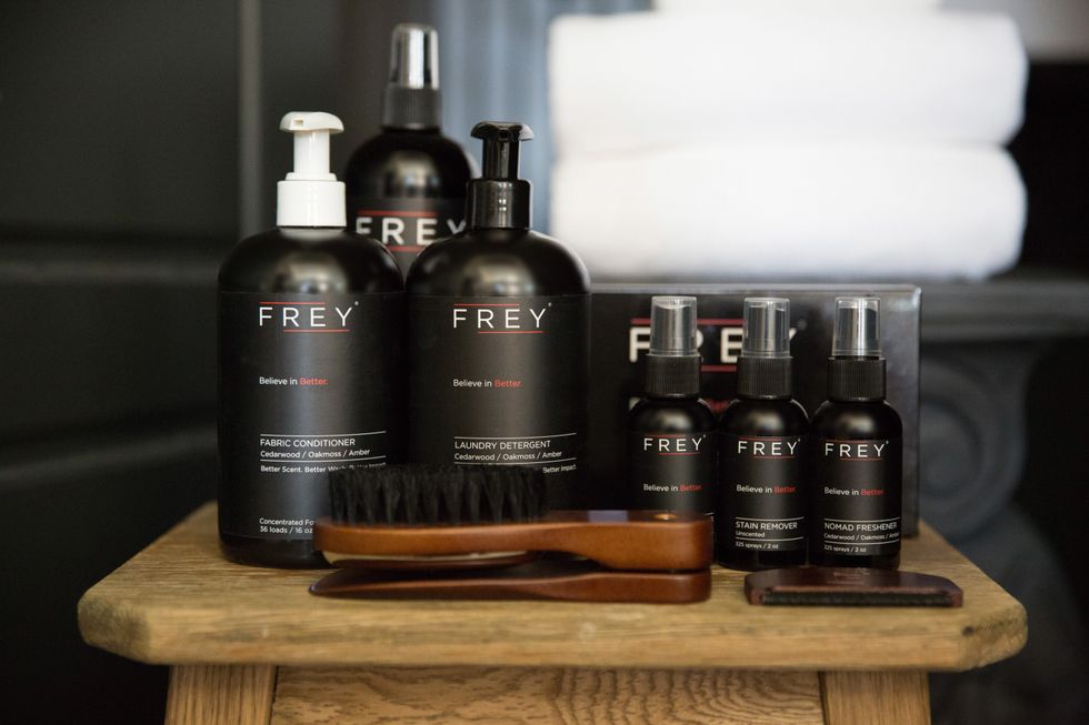 An array of Frey products are lined up on a wooden table
