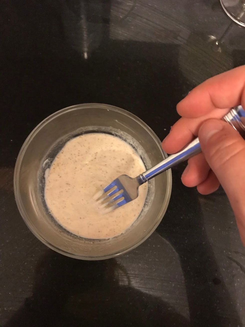 chipotle crema in a cup with a fork