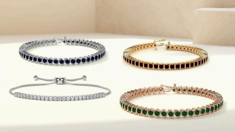 four tennis bracelets on display in four different styles: silver with diamonds and gold with gemstones by gemsny